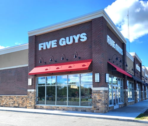 Exterior photograph of the Five Guys restaurant at 10 Hampton House Road in Newton, New Jersey.