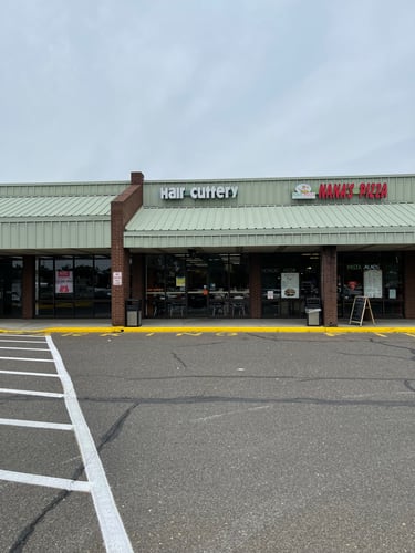 The front entrance of Hair Cuttery at Berlin Circle Plaza.