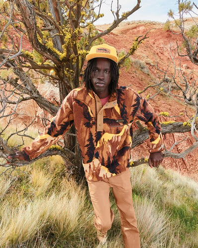 Man standing in front of a tree