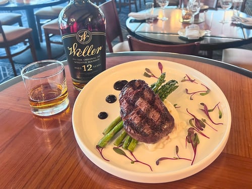Photo of 12oz cut ribeye, asparagus, yukon gold mashed potatoes, steak butter,
sautéed peppers and onions, balsamic reduction.