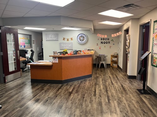 Lobby area with a front desk, creating a welcoming and organized space for parents and visitors.
