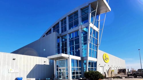 Leon's Burlington Store on a clear blue sky day.