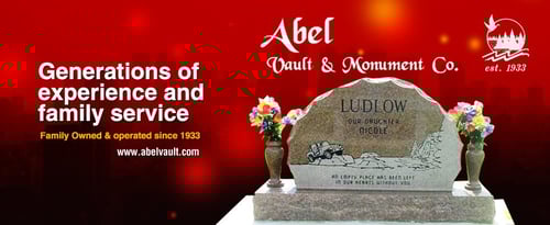 company logo with etched headstone