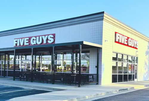 Exterior photograph of the Five Guys restaurant at 908 Buford Highway in Cumming, Georgia.