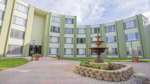 A courtyard with a fountain in front of an apartment building at Regency Park, Reno, Nevada