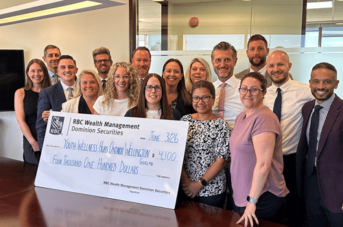 The ES Team presenting a cheque for our fundraising efforts with the Youth Wellness Hubs.