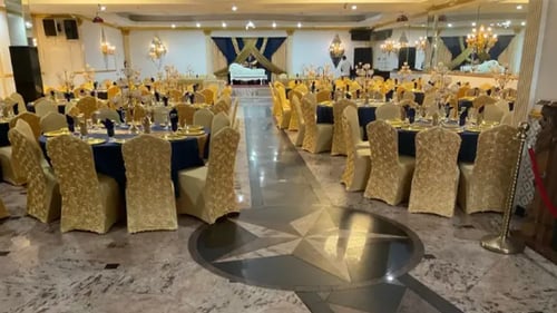 Venue decorated with a black and gold theme