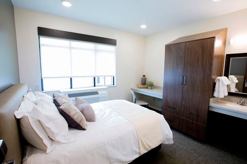 Residential rooms come with a full-size bed, desk, wardrobe and sink. Mattresses can be flipped for a pillow top or firmer surface depending on individual preference.