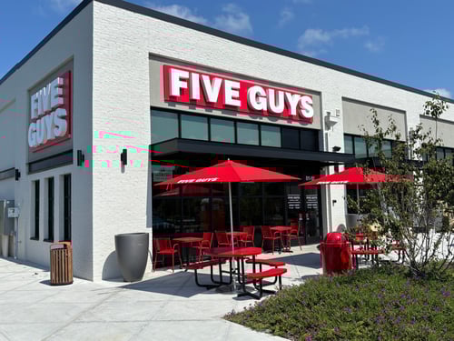 Exterior photograph of the Five Guys restaurant at 811 South Main Street in Rolesville, North Carolina.