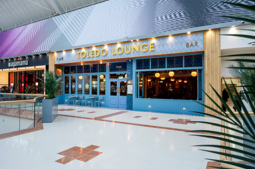 Outside of Toledo Lounge, showing its blue exterior in Merry Hill Shopping Centre