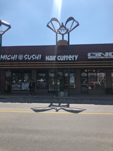 The front entrance of Hair Cuttery at West Goshen Shopping Center.