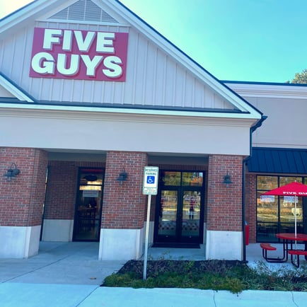 Exterior photograph of the entrance to the Five Guys restaurant at 70e England Street in Ashland Virginia.