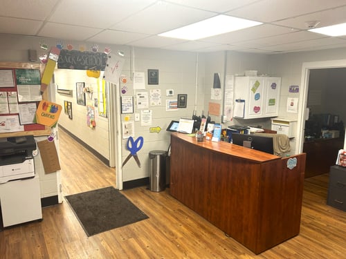 Lobby area with a front desk, creating a welcoming and organized space for parents and visitors.