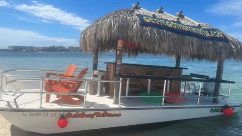 tiki boat parked on the sand