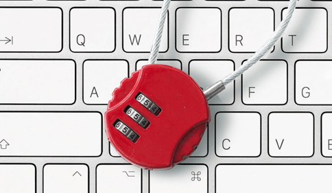 combination lock superimposed over a computer keyboard