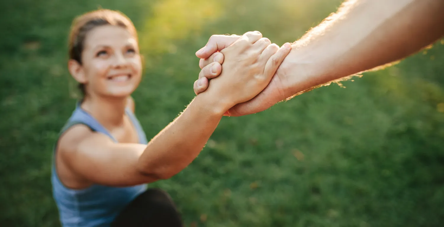 woman grabbing another hand