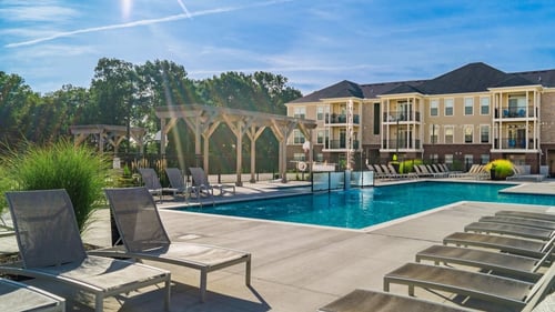 Pool with lounge chairs on sundeck at The Greyson, Hilliard, Ohio