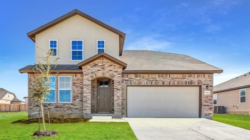 two-story home with stone and brick exterior