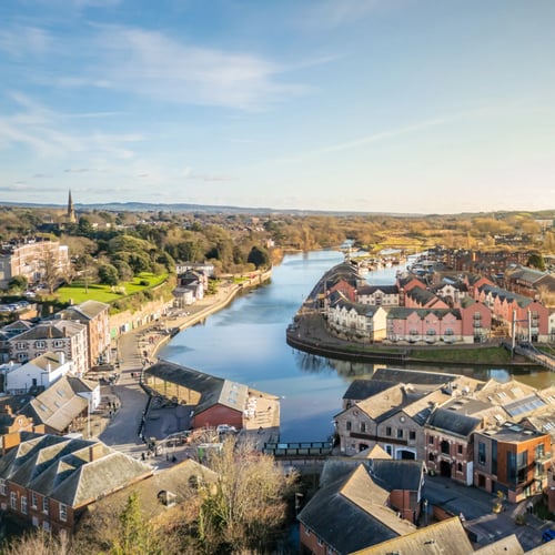 Knight Frank Exeter Estate Agents aerial view of Exeter quay showing historic waterfront buildings and the river curving through the town_1_1