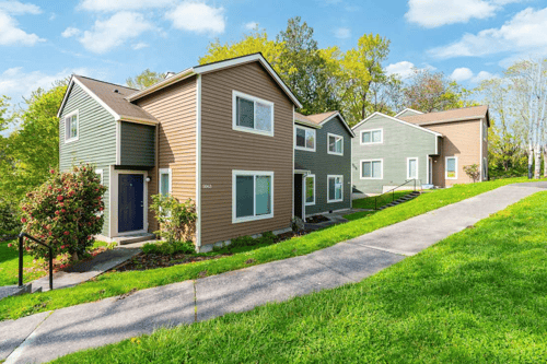 Exterior of apartment building and green grass