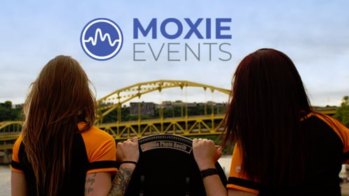 two people with company banner