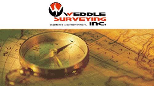 compass laying on map with company logo