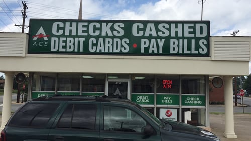 Exterior of ACE Cash Express at 3422 Pike Ave North Little Rock AR, offering check cashing and money orders.
