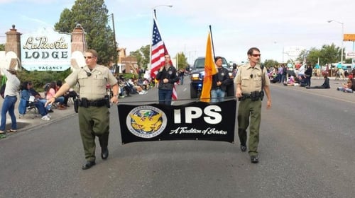 security officers holding company sign