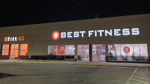Best Fitness Chelmsford exterior at night with new illuminated storefront sign.