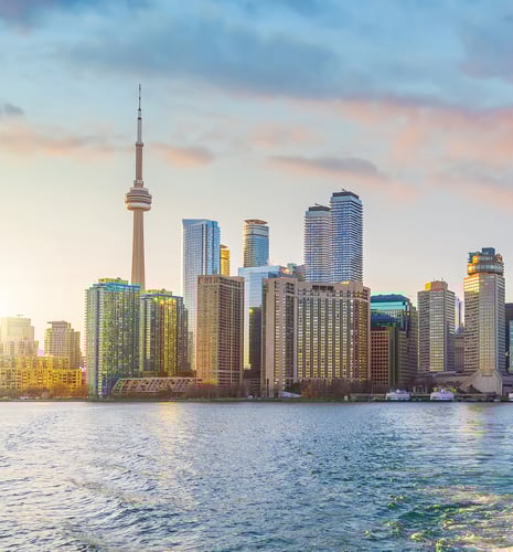 The Toronto city skyline at dusk.