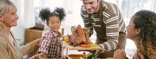 Family enjoying Thanksgiving dinner