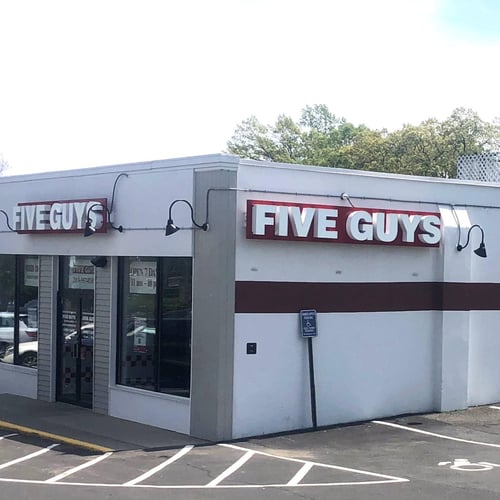 Exterior photograph of the Five Guys restaurant at 534 Post Road East in Westport Connecticut.