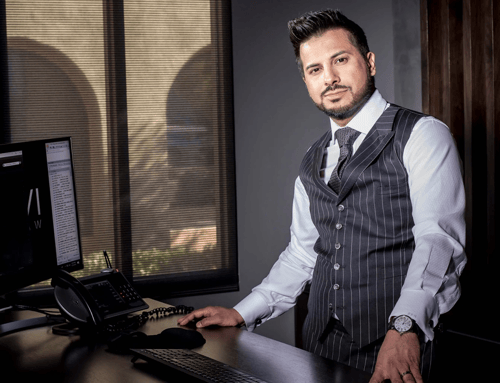 Farhan Naqvi Headshot at computer