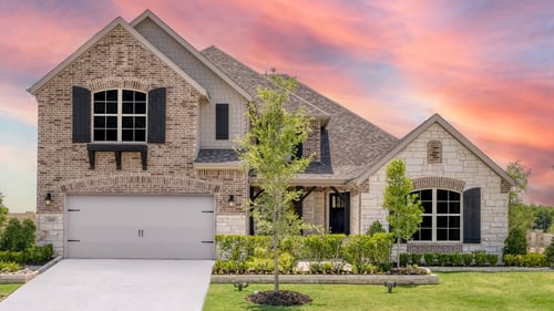 two-story single-family home with stone exterior
