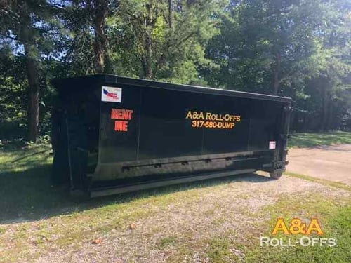 dumpster in driveway