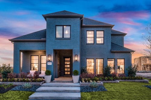 Exterior of the Normandy Homes model at Windsong Ranch in Prosper, TX.