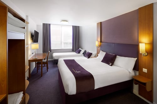 Premier Inn family room with double bed, two single beds and a flat screen TV
