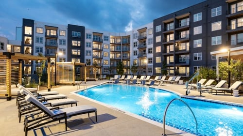 lighted resort style pool in the evening