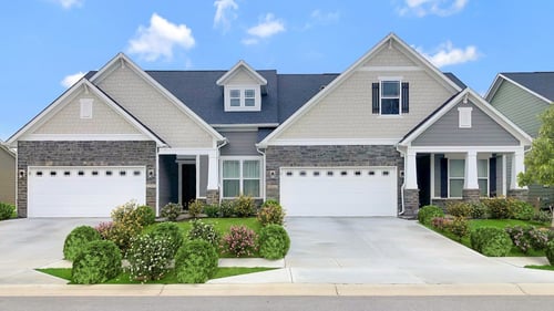 new duplexes with separate white garages