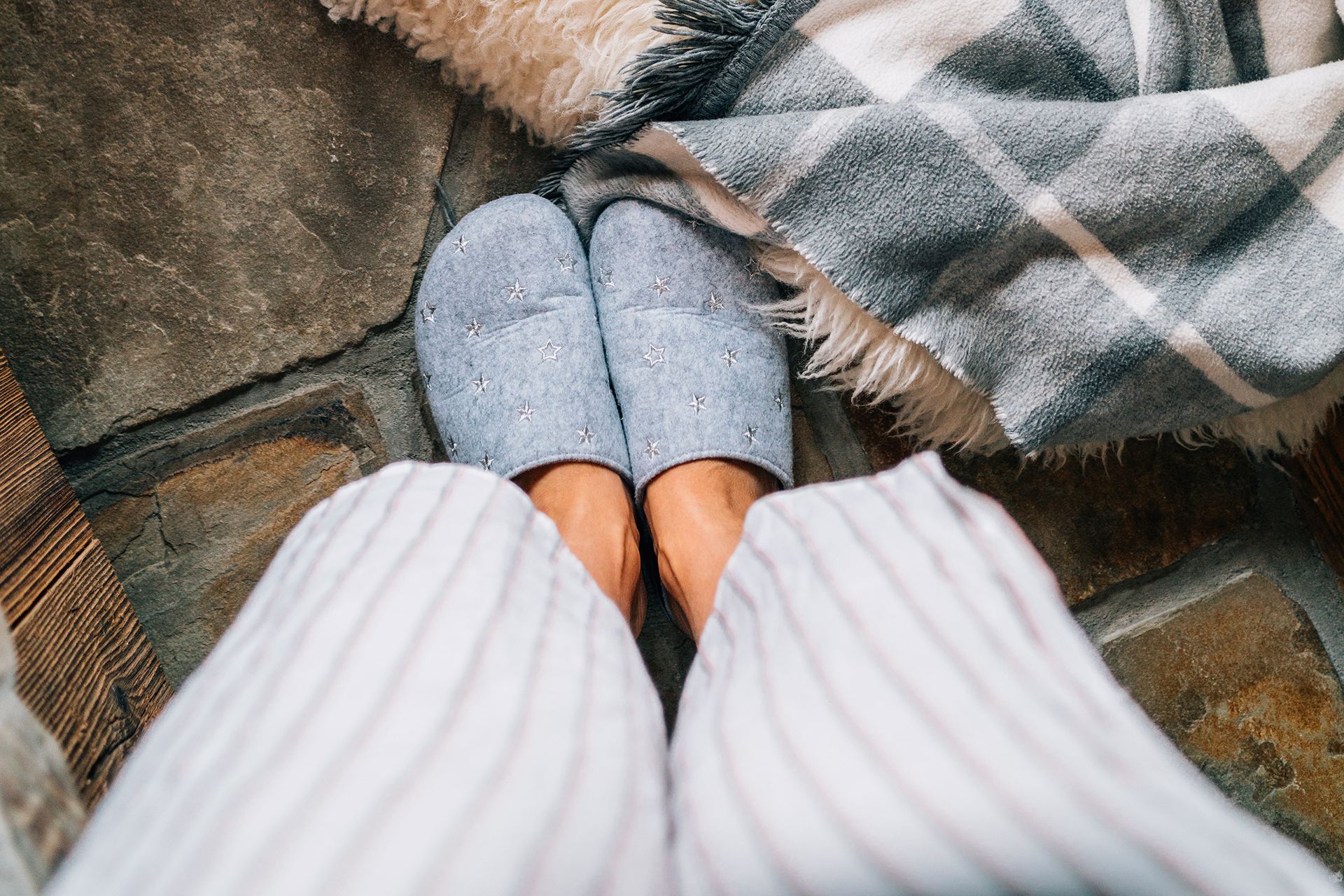 person looking at their feet in slippers