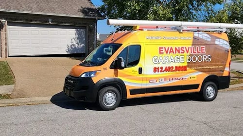 evansville garage door service truck in front of a white garage door.
