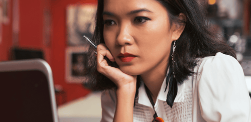 woman looking at computer screen