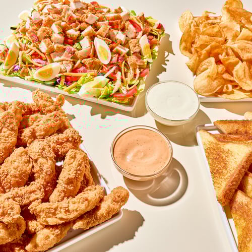 Platters of Chicken Fingerz, Cobb Zalad, Tater Chips, and Toast with Ranch sauce and Zax Sauce(R).
