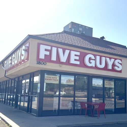Exterior photograph of the Five Guys restaurant at 1800 South Milton Road in Flagstaff Arizona.