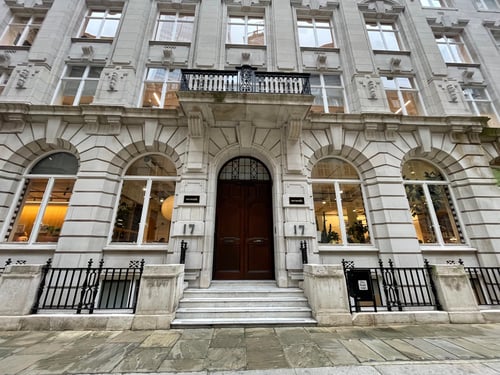 Large, brown double doors serving as the front entrance to Insight Global's London office