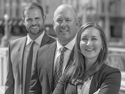 Photo of attorneys Lance W. Dunford, Scott T. Moorey, and Jill Prenger