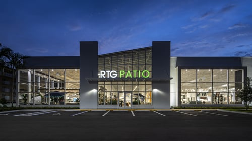white and green storefront for Rooms To Go Patio - outdoor furniture store in naples, fl