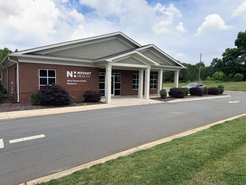 External building view with bricks and white columns, of Novant Health West Rowan Family Medicine.