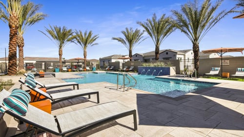 pool deck and sun lounges at avilla gateway in West Valley,AZ