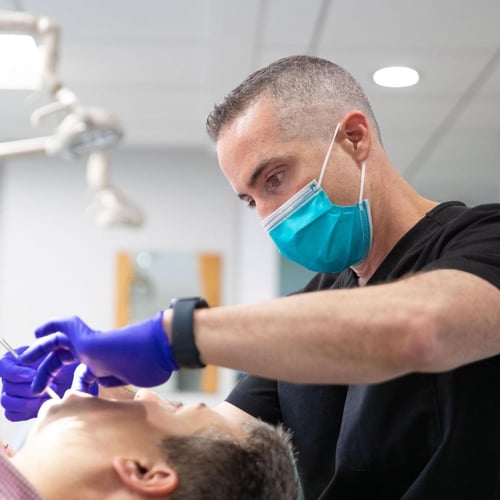 Dr. Orbach providing expert dental care to patient at Orbach Orthodontics Falls Church